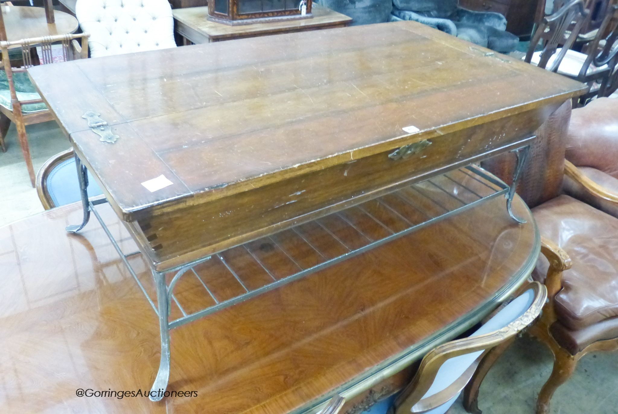 A rectangular Continental hinged walnut and wrought iron coffee table, width 132cm, depth 71cm, height 49cm